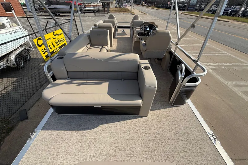 Slide: The Image of 2019 Avalon Venture 1880 CRB pontoon boat with beige seating and steering console. - 23