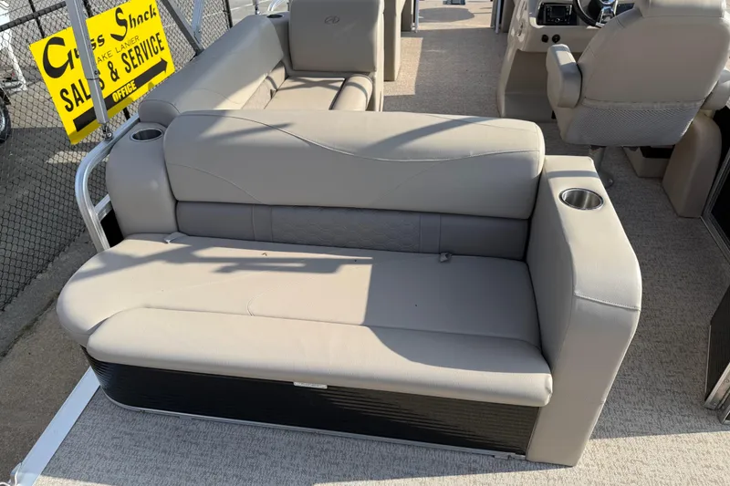 Slide: The Image of 2019 Avalon Venture 1880 CRB boat interior with beige seating and cup holders. - 25