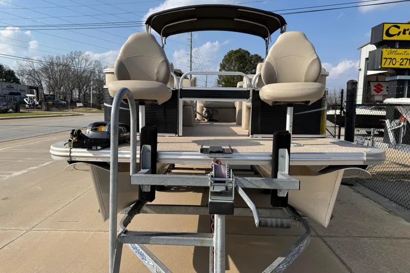 Slide: The Image of 2019 Avalon Venture 1880 CRB pontoon boat on trailer, outdoor display. - 4