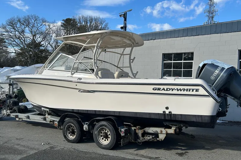 The Image of 2017 Grady-White Freedom 285 boat on trailer, parked outdoors. - 0