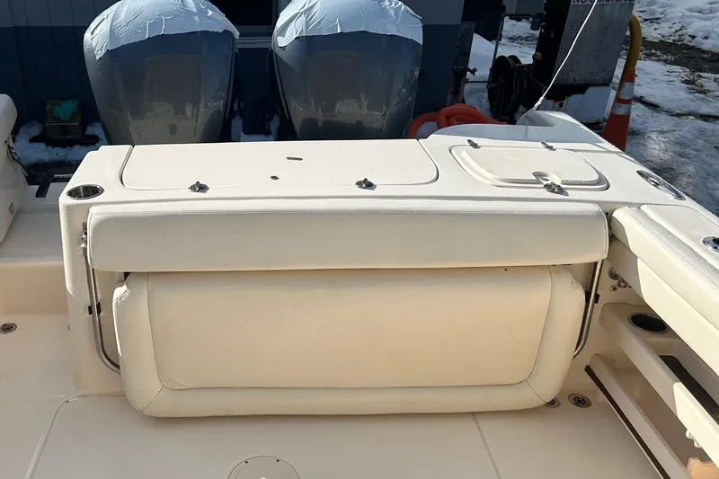 Slide: The Image of 2017 Grady-White Freedom 285 boat interior with dual engines and seating. - 6