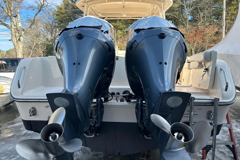 Slide: The Image of 2017 Grady-White Freedom 285 boat with dual outboard engines, rear view. - 8