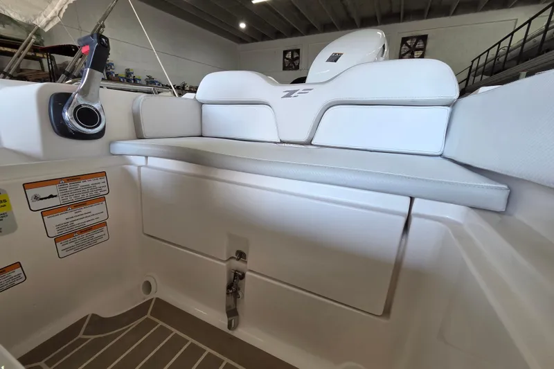 Slide: The Image of 2023 Zar ZF-0 boat interior with Suzuki 40HP engine, featuring white seating and control panel. - 10