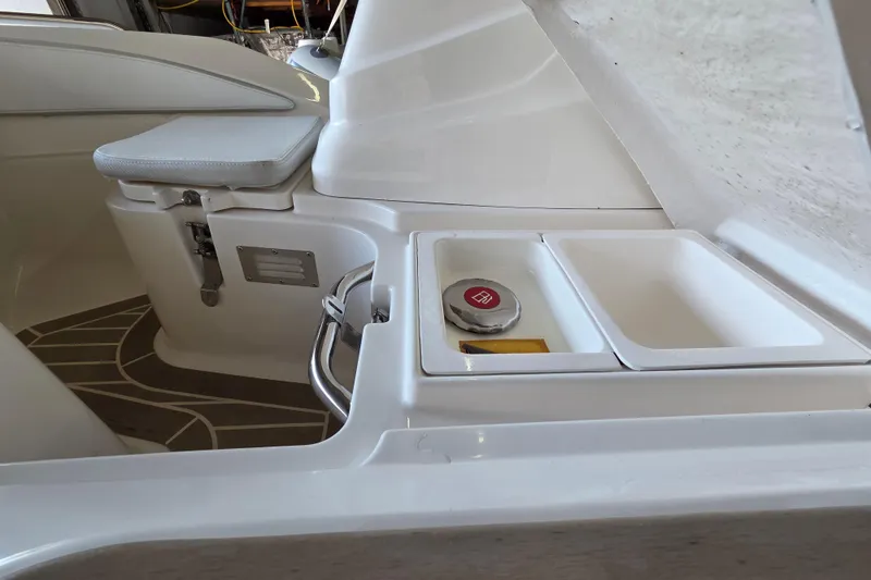 Slide: The Image of 2023 Zar ZF-0 boat interior with Suzuki 40HP, featuring sleek white seating and storage compartments. - 11