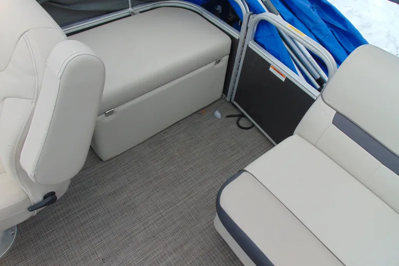 Slide: The Image of Interior of 2019 Godfrey SW 180C boat with beige seating and carpeted floor. - 14