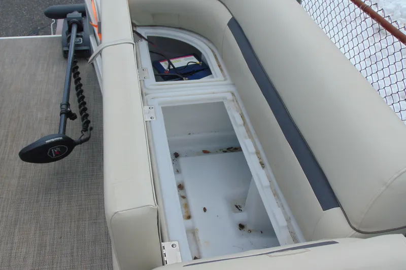 Slide: The Image of 2019 Godfrey SW 180C boat interior with open storage compartment. - 19