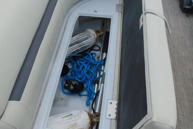 Slide: The Image of Storage compartment in 2019 Godfrey SW 180C boat with blue rope and fenders. - 20