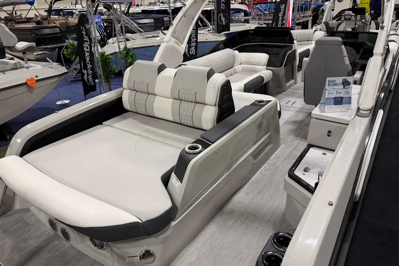 Slide: The Image of 2026 Avalon 2785 27-3 Excalibur LTD VRBW luxury pontoon boat interior at a boat show. - 2
