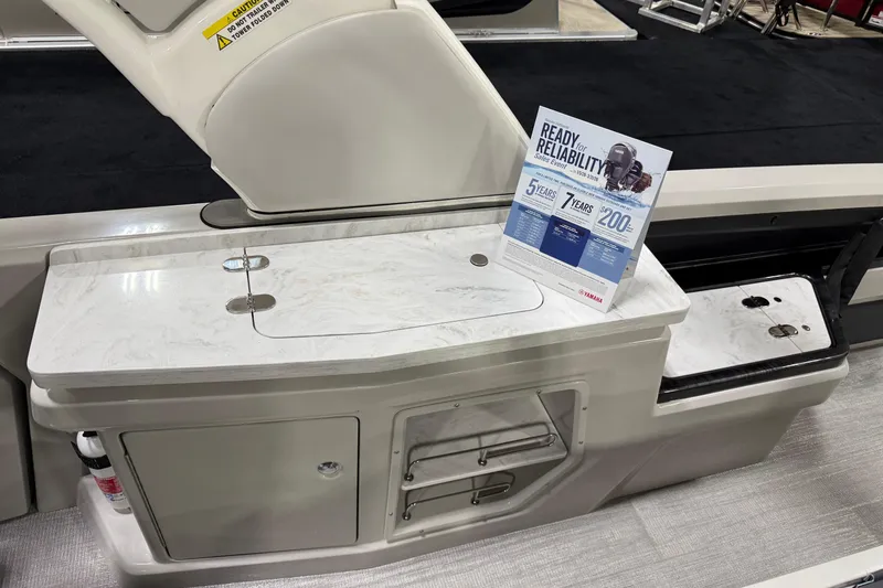 Slide: The Image of 2026 Avalon 2785 27-3 Excalibur LTD VRBW boat interior with marble countertop and reliability sign. - 4