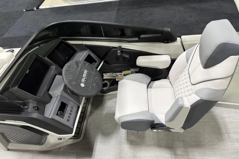 Slide: The Image of 2026 Avalon 2785 27-3 Excalibur LTD VRBW boat cockpit with modern steering and seating. - 5