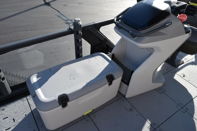 Slide: The Image of 2026 Sea-Doo Switch Fish 21 interior with storage compartment and control console. - 10