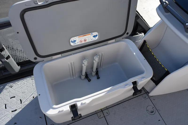 Slide: The Image of 2026 Sea-Doo Switch Fish 21 storage compartment with open lid, showcasing interior space. - 11