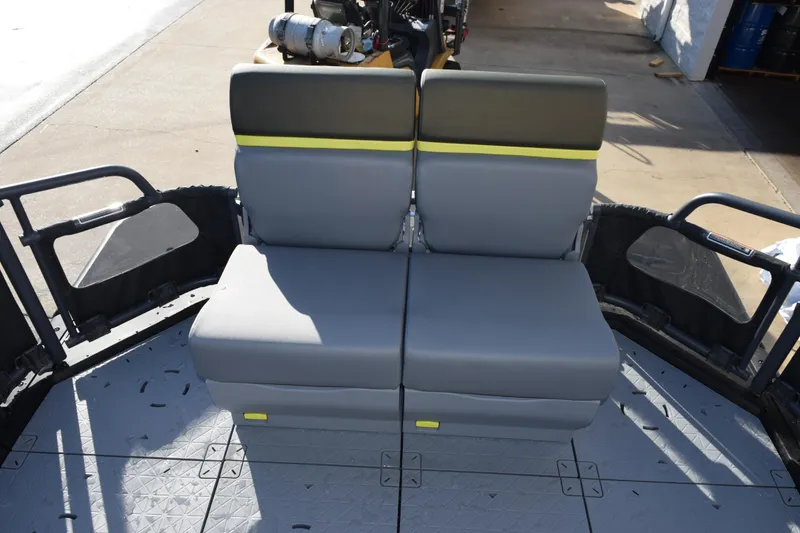 Slide: The Image of 2026 Sea-Doo Switch Fish 21 boat seating area with gray and yellow cushioned seats. - 14