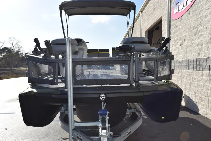 Slide: The Image of 2026 Sea-Doo Switch Fish 21 pontoon boat on trailer, front view. - 3
