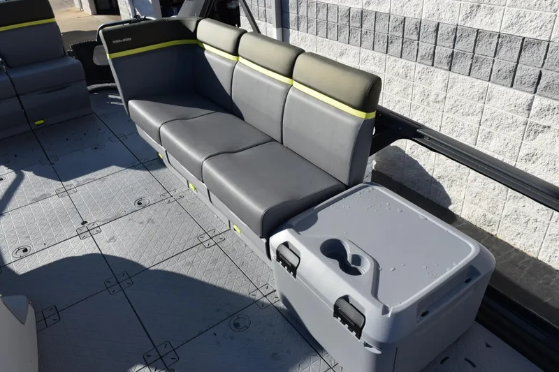 Slide: The Image of 2026 Sea-Doo Switch Fish 21 interior with gray seating and storage compartment. - 9