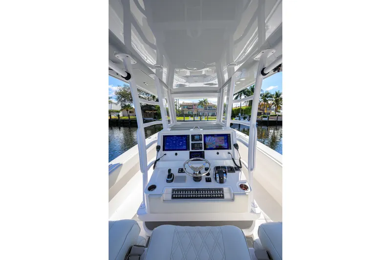 Slide: The Image of 2021 Invincible 39 Open Fisherman boat cockpit with advanced navigation systems. - 20