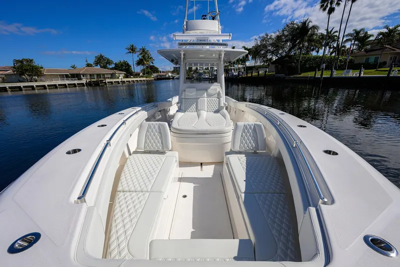 Slide: The Image of 2021 Invincible 39 Open Fisherman boat with luxurious seating on a calm waterway. - 37