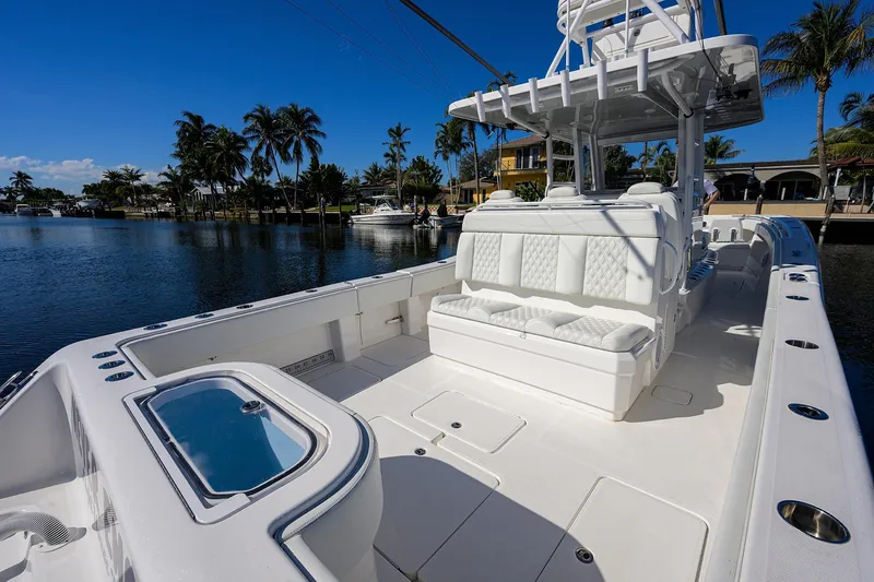 Slide: The Image of 2021 Invincible 39 Open Fisherman boat with spacious seating and sleek design on a sunny day. - 50