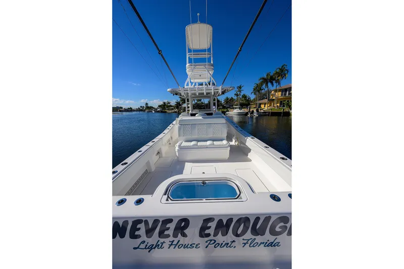 Slide: The Image of 2021 Invincible 39 Open Fisherman boat docked in sunny Florida marina. - 52
