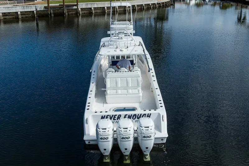Slide: The Image of 2021 Invincible 39 Open Fisherman boat with triple 400 engines on calm water. - 6
