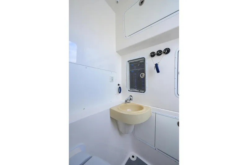 Slide: The Image of 2021 Invincible 39 Open Fisherman interior with sink and control panel. - 67