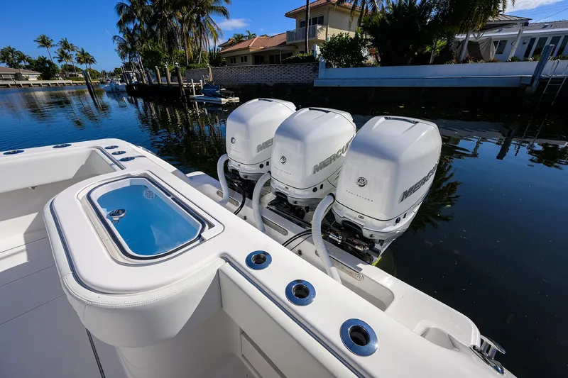 Slide: The Image of 2021 Invincible 39 Open Fisherman with triple Mercury engines docked by waterfront homes. - 71