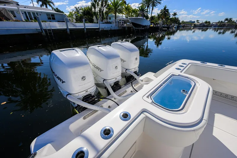 Slide: The Image of 2021 Invincible 39 Open Fisherman with triple Mercury engines docked by waterfront homes. - 74