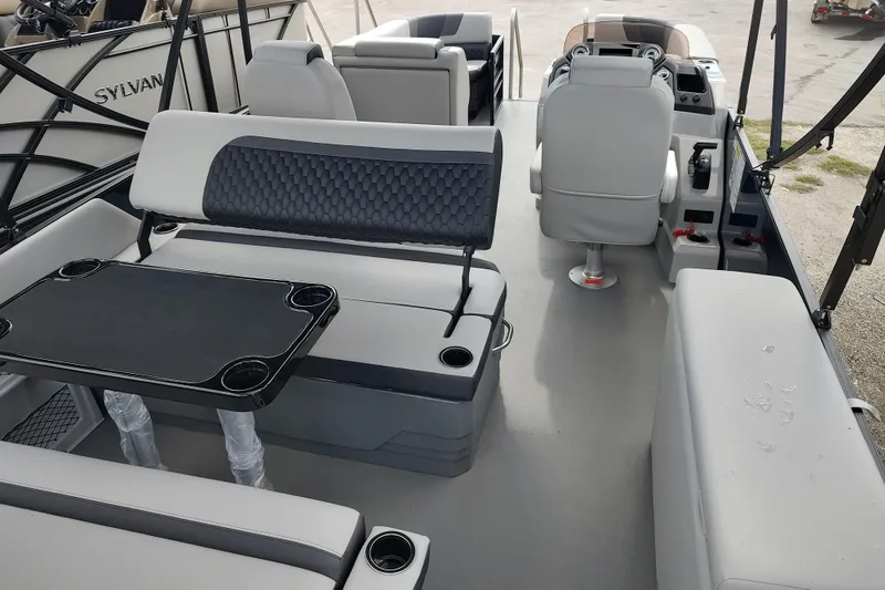 Slide: The Image of Interior of 2026 Sylvan L3 DLZ pontoon boat with seating and helm. - 16