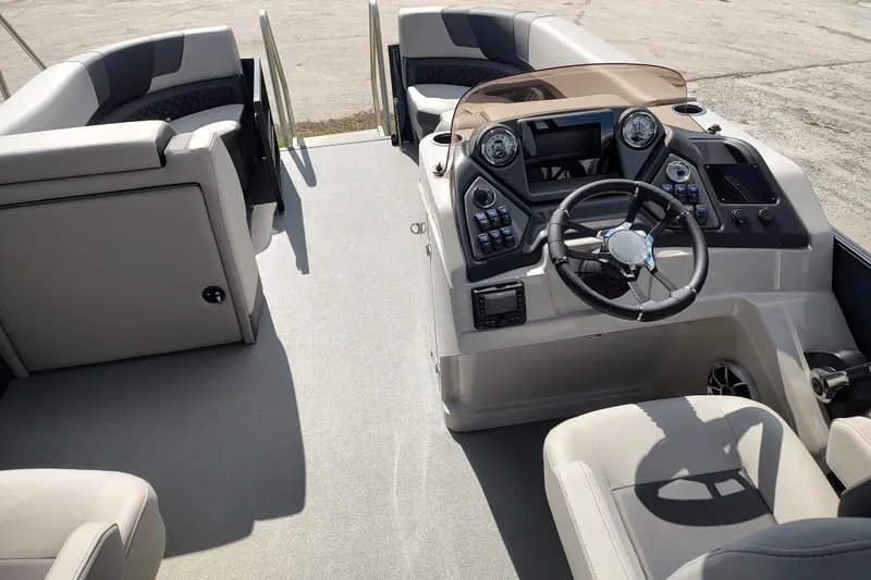 Slide: The Image of 2026 Sylvan L3 DLZ pontoon boat covered on trailer, outdoor storage. - 18