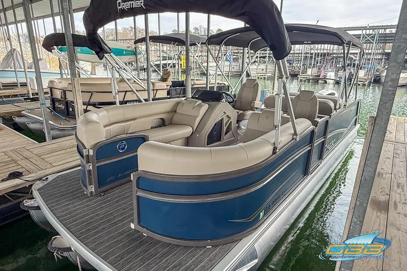 Slide: The Image of 2021 Premier 230 Sunsation RL PTX pontoon boat docked in marina. - 10