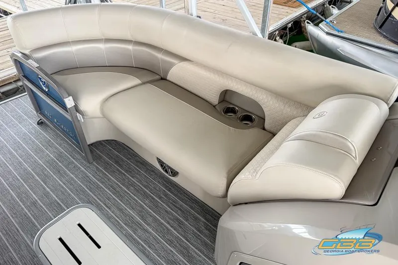 Slide: The Image of 2021 Premier 230 Sunsation RL PTX pontoon boat with luxurious seating and cup holders. - 12