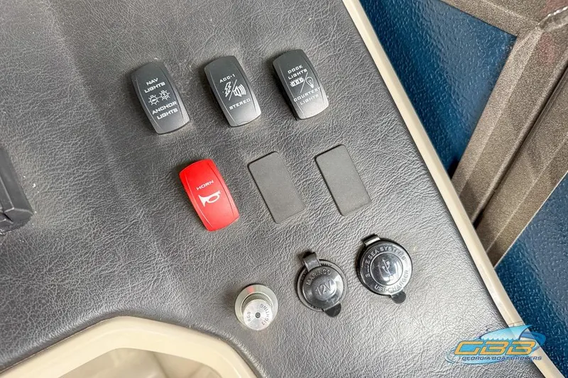 Slide: The Image of Control panel of 2021 Premier 230 Sunsation RL PTX with switches and USB charger. - 18