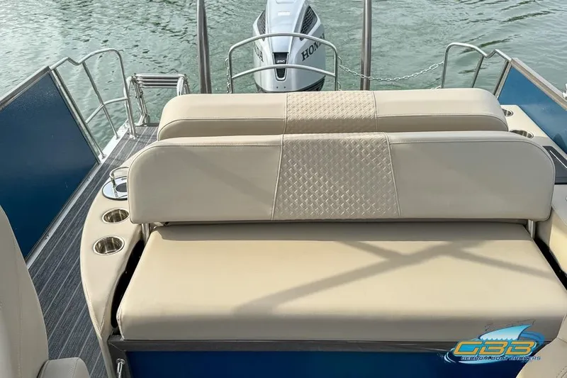 Slide: The Image of 2021 Premier 230 Sunsation RL PTX boat with beige seating and Honda outboard motor. - 22