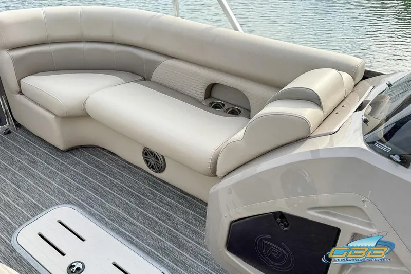 Slide: The Image of 2021 Premier 230 Sunsation RL PTX boat interior with plush seating and modern design. - 24