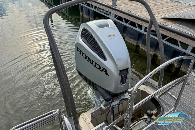 Slide: The Image of 2021 Premier 230 Sunsation RL PTX with Honda outboard motor at dock. - 26