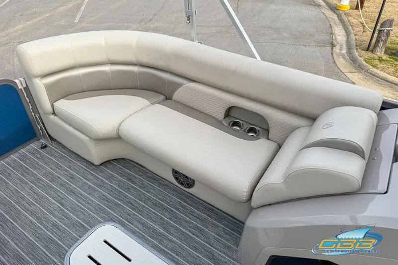 Slide: The Image of 2021 Premier 230 Sunsation RL PTX boat interior with plush seating and cup holders. - 28
