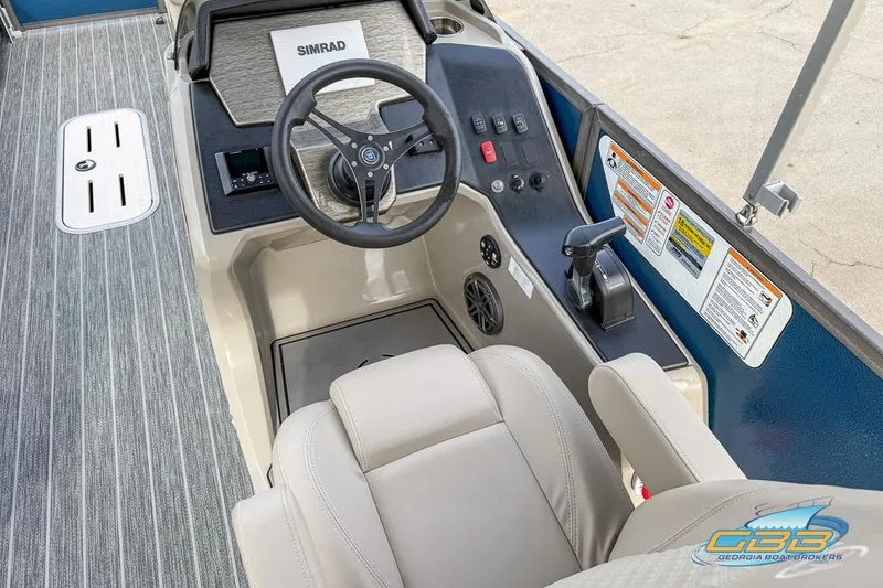 Slide: The Image of 2021 Premier 230 Sunsation RL PTX boat helm with steering wheel and controls. - 29