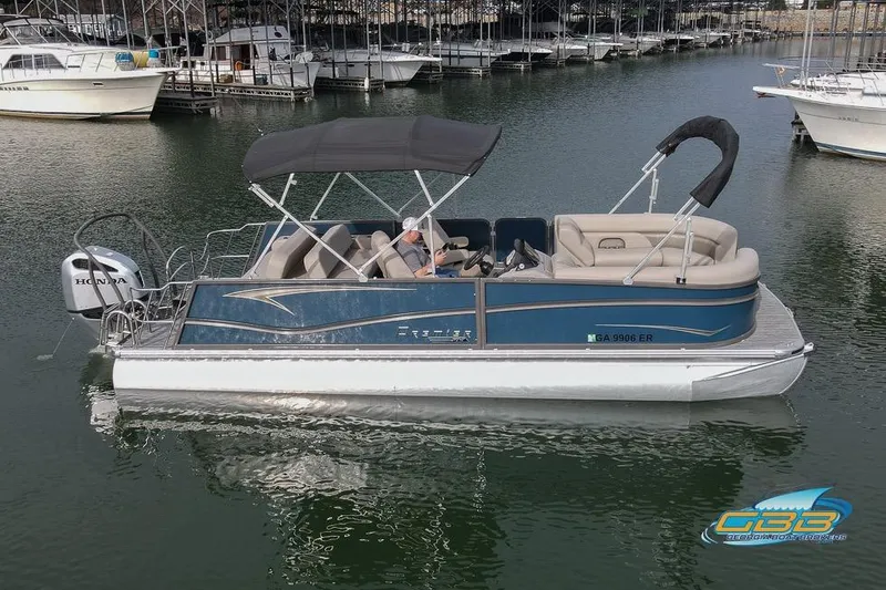 Slide: The Image of 2021 Premier 230 Sunsation RL PTX pontoon boat on calm water with canopy. - 3
