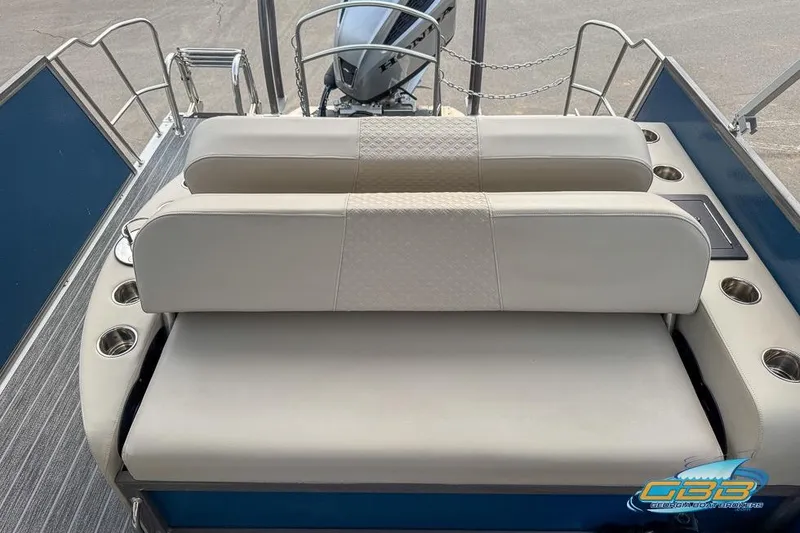 Slide: The Image of 2021 Premier 230 Sunsation RL PTX boat with beige seating and cup holders. - 31