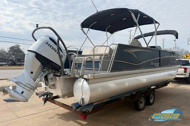 Slide: The Image of 2021 Premier 230 Sunsation RL PTX pontoon boat with Honda outboard motor on trailer. - 33
