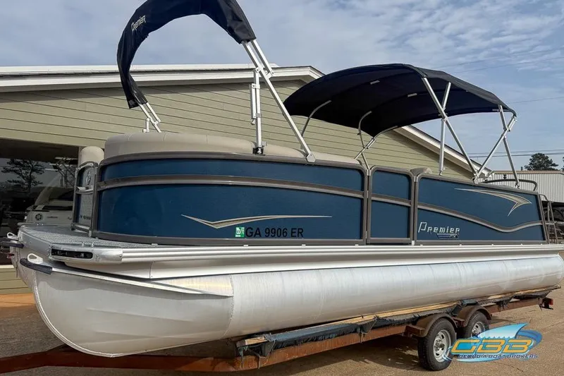 Slide: The Image of 2021 Premier 230 Sunsation RL PTX pontoon boat on trailer, blue and silver design. - 35