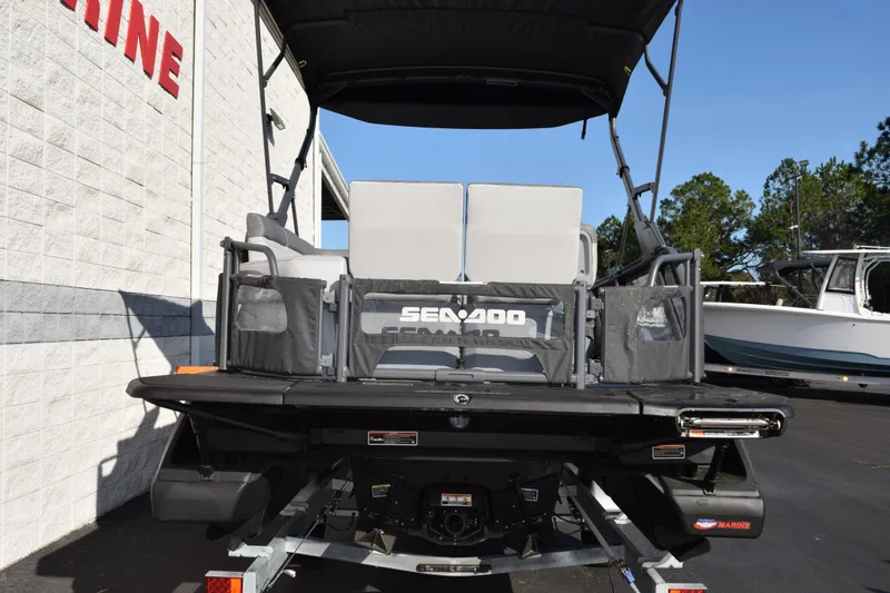 Slide: The Image of 2026 Sea-Doo Switch Cruise 21 pontoon boat, rear view, on trailer. - 5