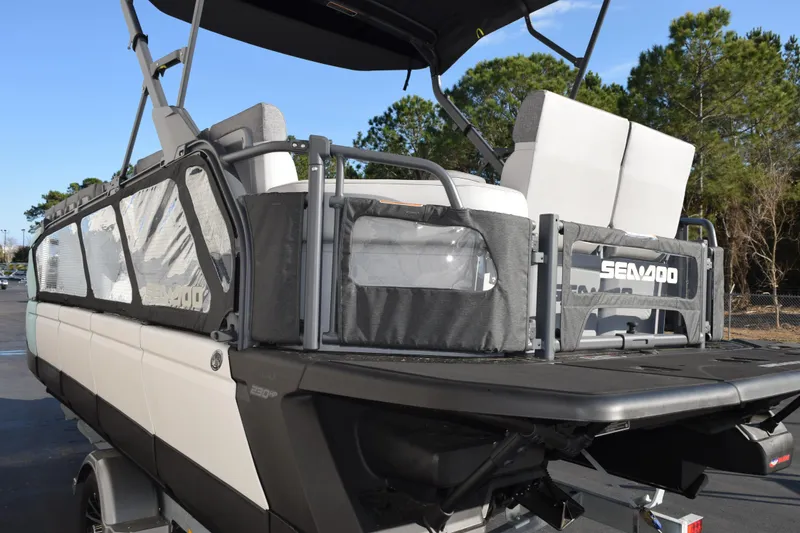 Slide: The Image of 2026 Sea-Doo Switch Cruise 21 pontoon boat, rear view with seating and canopy. - 6