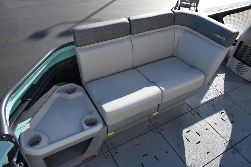 Slide: The Image of 2026 Sea-Doo Switch Cruise 21 interior seating with cup holders and gray upholstery. - 8
