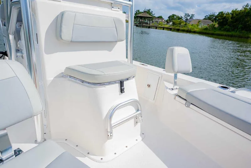 Slide: The Image of Manufacturer Provided Image: 2025 Bay Rider 219 Bay boat interior with cushioned seating and sleek design by the water. - 10