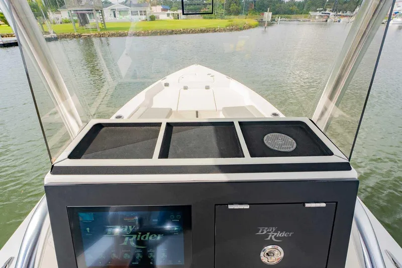 Slide: The Image of 2026 Bay Rider 219 Bay boat console with waterway view. - 17