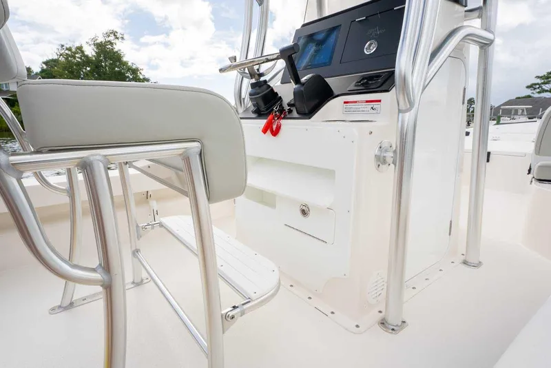 Slide: The Image of 2026 Bay Rider 219 Bay boat interior with steering console and seating. - 25