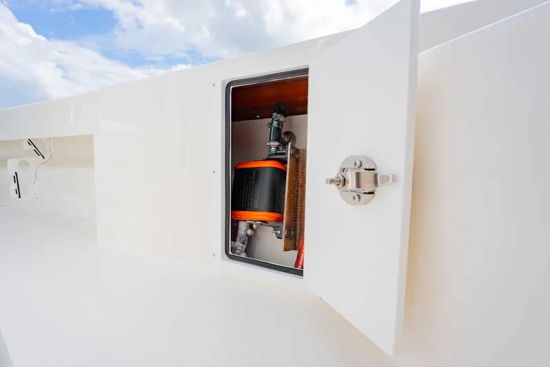 Slide: The Image of Open compartment on 2026 Bay Rider 219 Bay boat, showcasing internal components. - 28