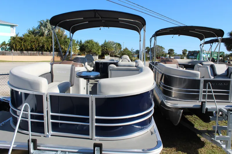The Image of 2025 Sylvan Mirage 820 PARTY FISH pontoon boats displayed outdoors. - 0