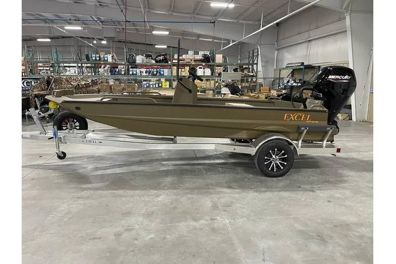 The Image of 2026 Excel Switchblade boat on trailer in warehouse setting. - 1